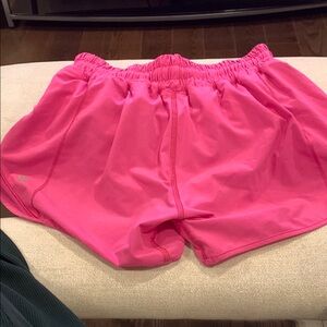 Vibrant Pink Athletic Shorts with Elastic Waistband. Inseam is 4 inches.